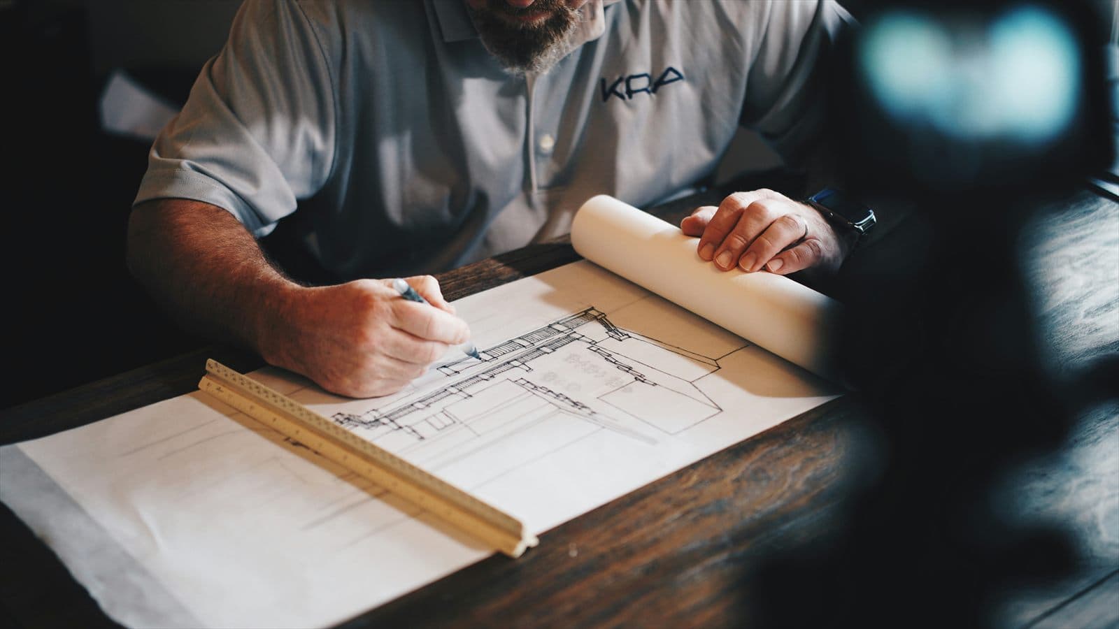 Architect drawing a building plan