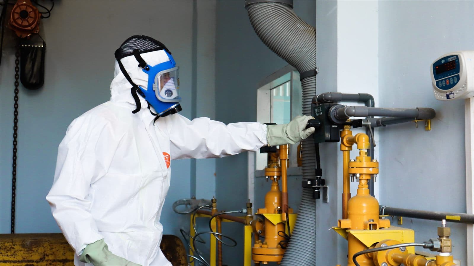 Environmental inspector wearing protective equipment